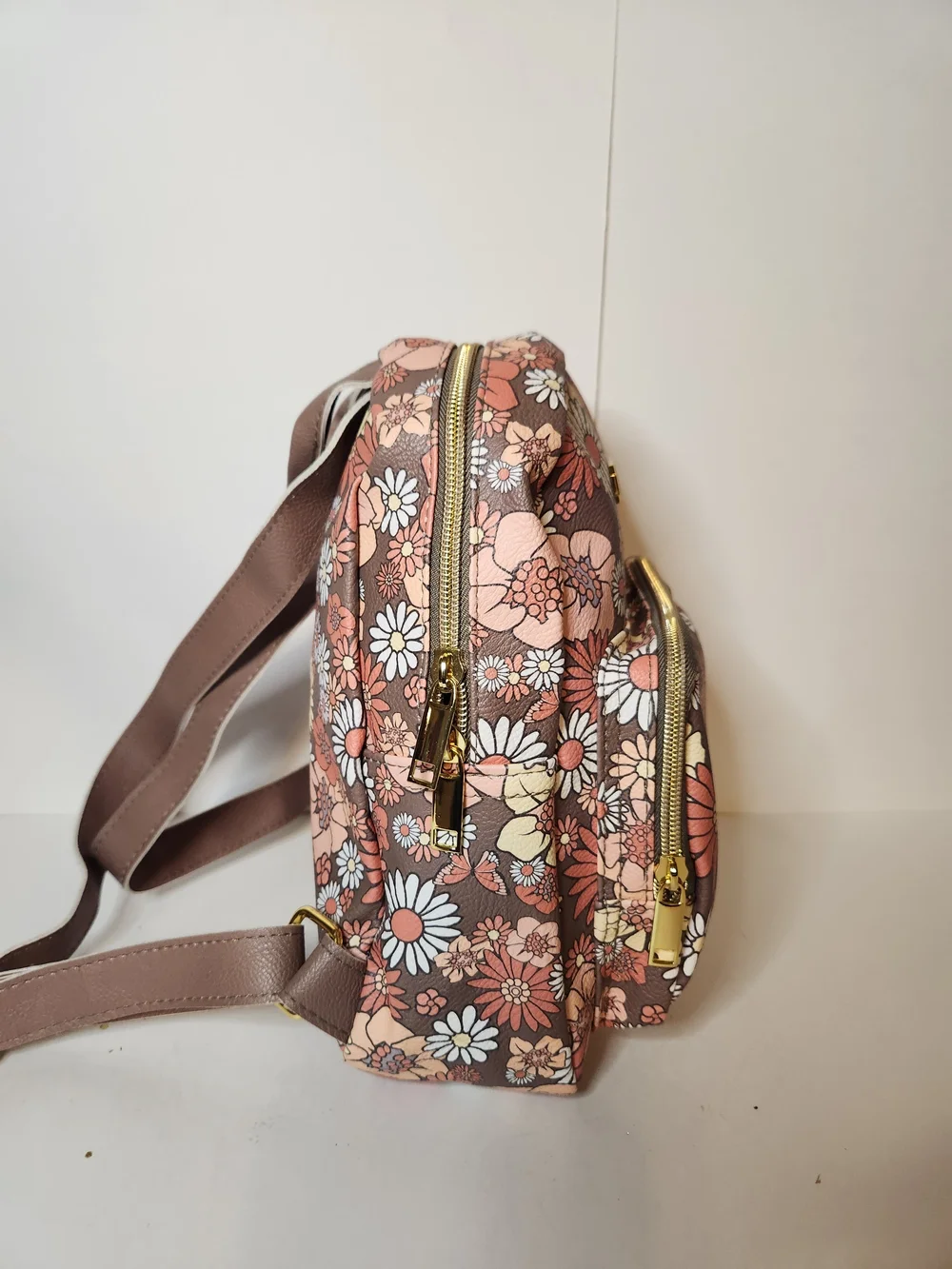 Jessica Simpson backpack with butterfly design.